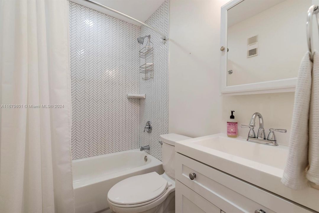 New flooring, vanity, shower tile.