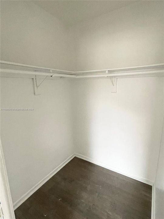 Primary bedroom walk in closet