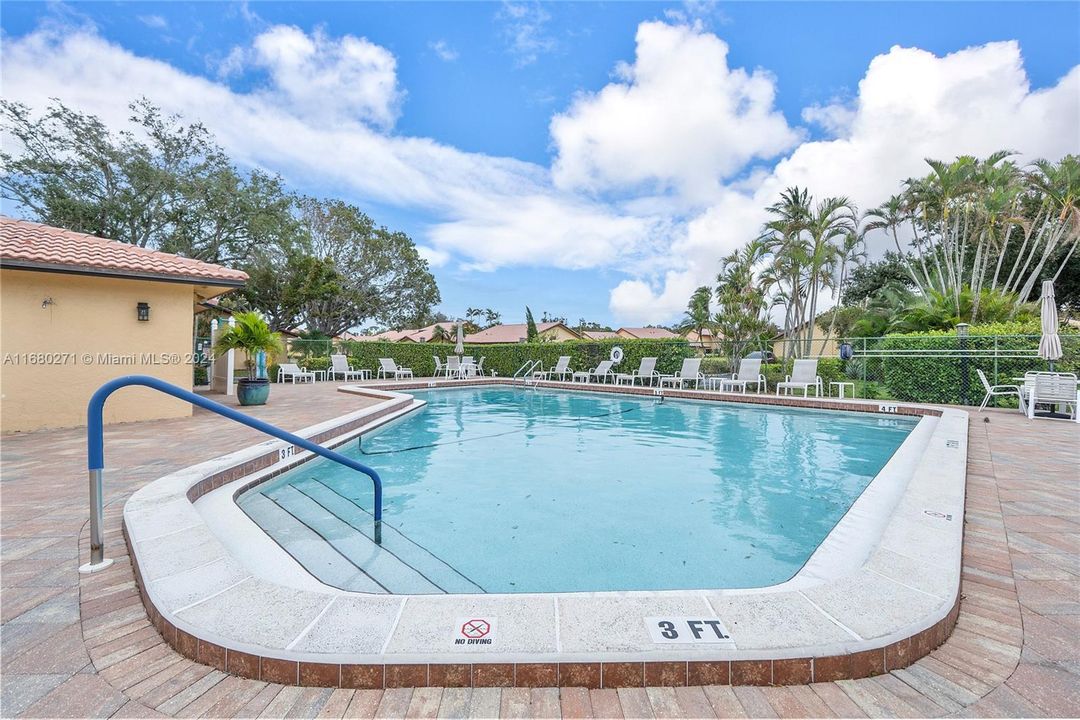 Gated Community Pool with lounge chairs