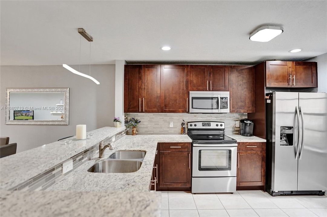 Complimenting Granite counters with a Tiled Backsplash!