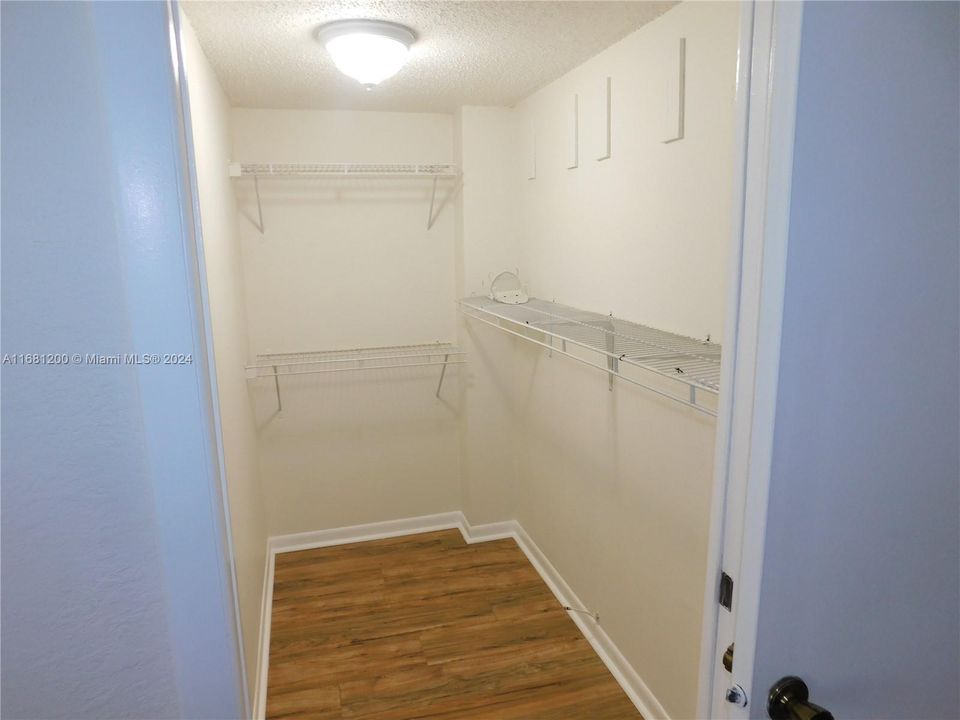 WALK IN CLOSET IN MASTER BEDROOM