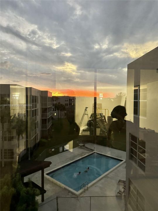 View from balcony, sunset overlooking the community pool