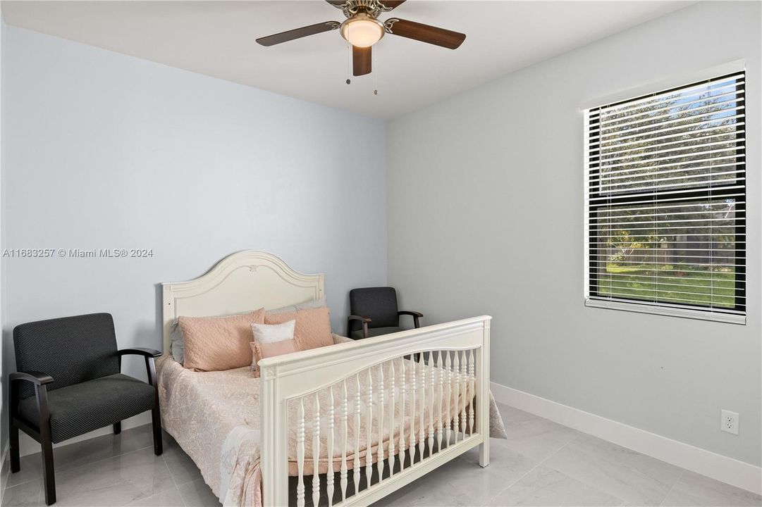 Bedroom featuring ceiling fan