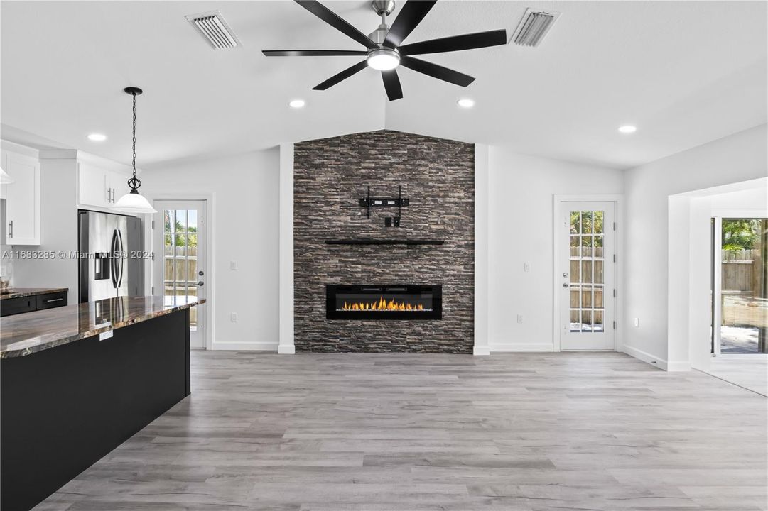 Two french doors for easy access out to the numerous patios and outdoor areas. TONS of natural light and attention to detail make this home stand out amongst the rest.