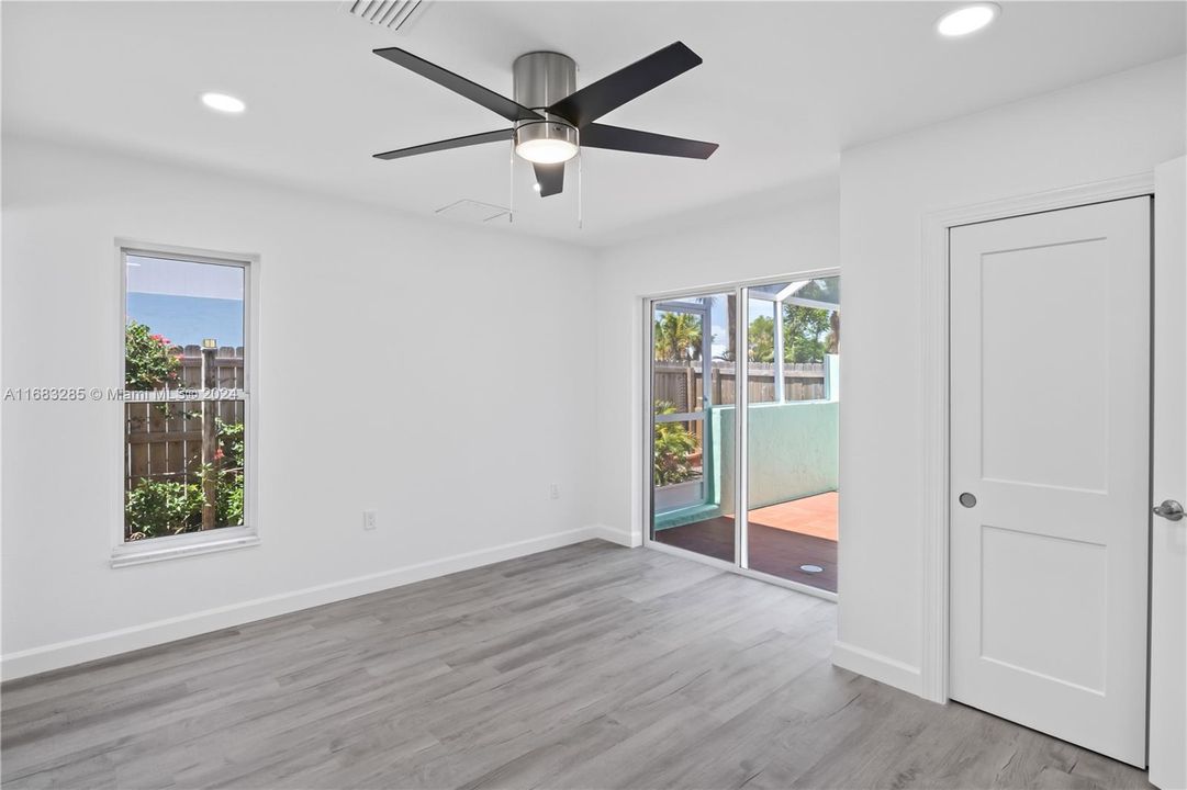 Second bedroom with double slider out to the patio and bathroom access!