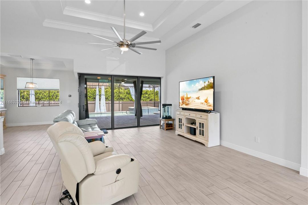 This is a super large living room with tons of wall space. Soaring ceilings with double tray accents.