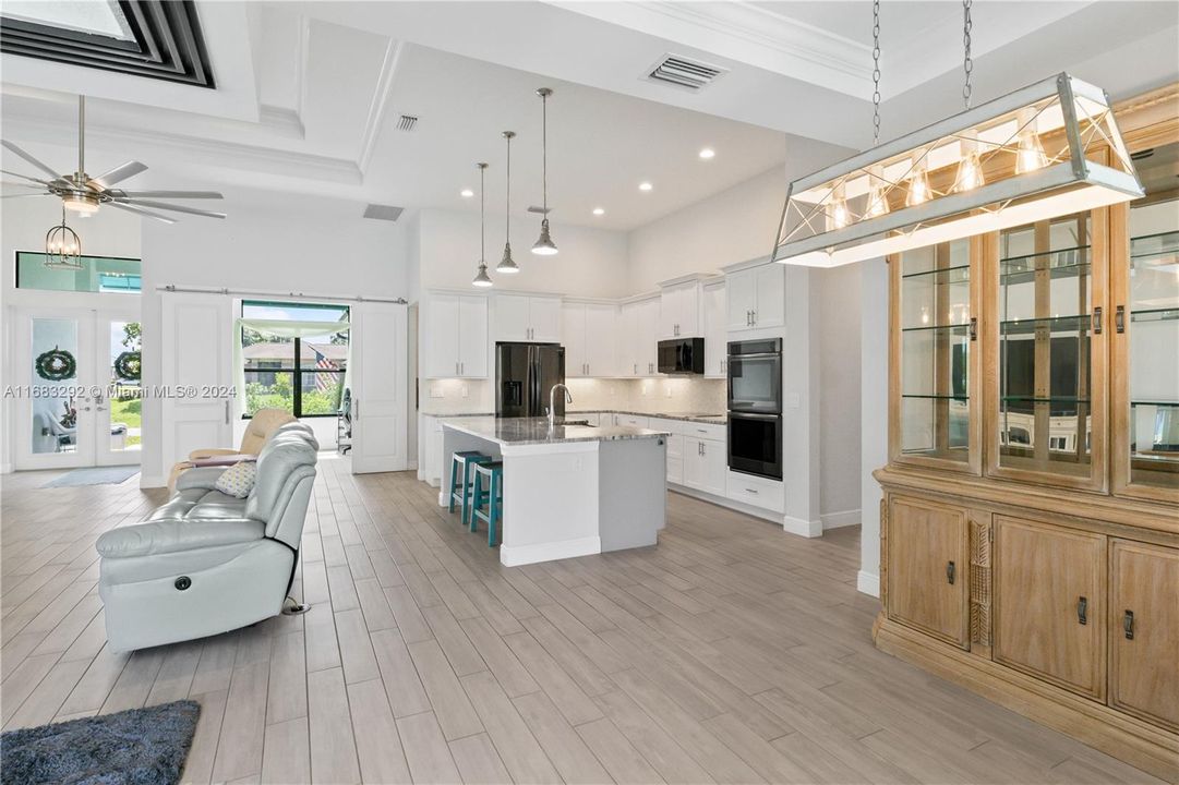 View from the dining area of the kitchen, great room and office!