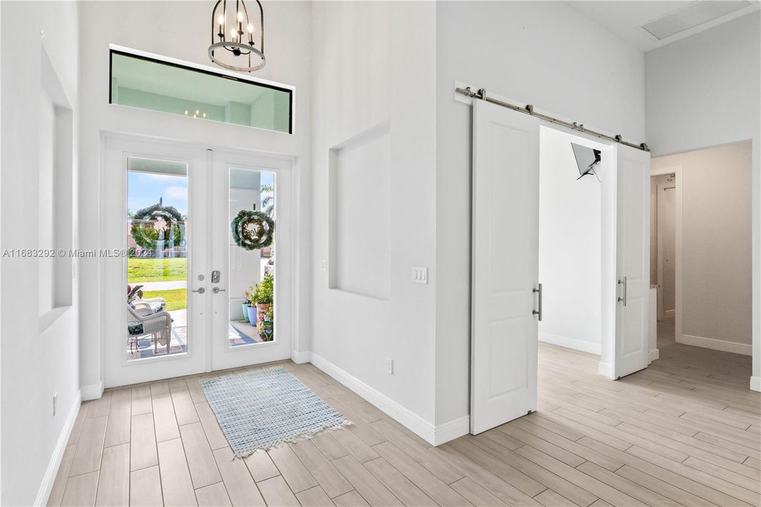 Beautiful double door with transom window welcome you into your new home! Ceramic tile flooring with neutral color palette and custom features throughout this beauty of a home!