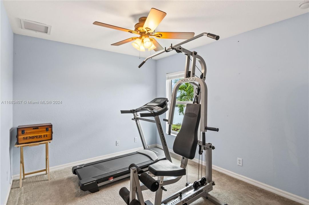 Fifth bedroom, used as a workout room.