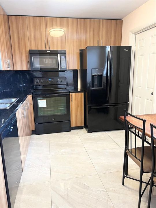 New appliances. Eat in kitchen. Oversized new tile floor.