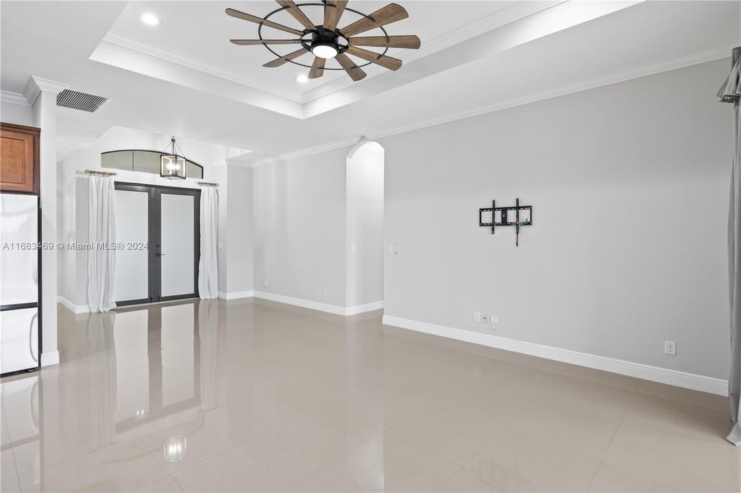 View from great room to the front double door entryway - plenty of large wall space to display art / decor throughout the home.