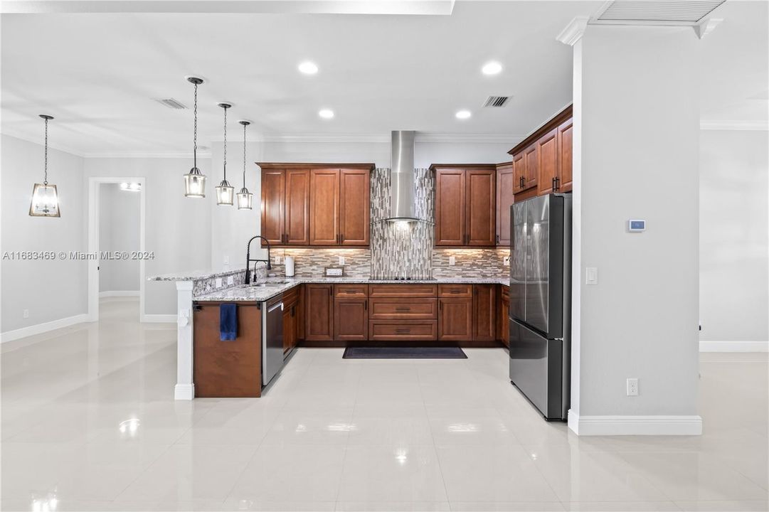 Kitchen is open to great room and features upgraded EVERYTHING! Soft touch close, custom lazy susan, even the fridge is super cool - you can change out the front covers to different colors with Samsung!