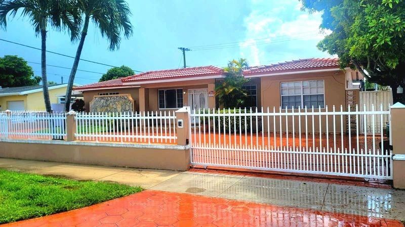 Electronic gates adorn the property