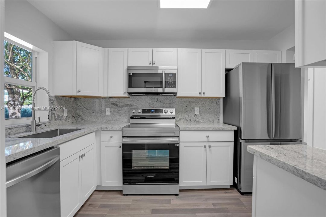 STATE OF THE ART KITCHEN WITH STAINLESS APPLIANCES