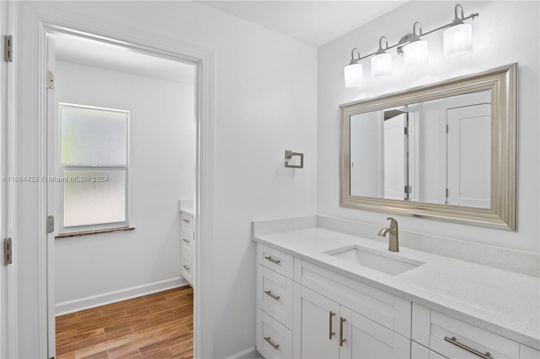 Master bath with dual vanities and gorgeous quartz countertops.