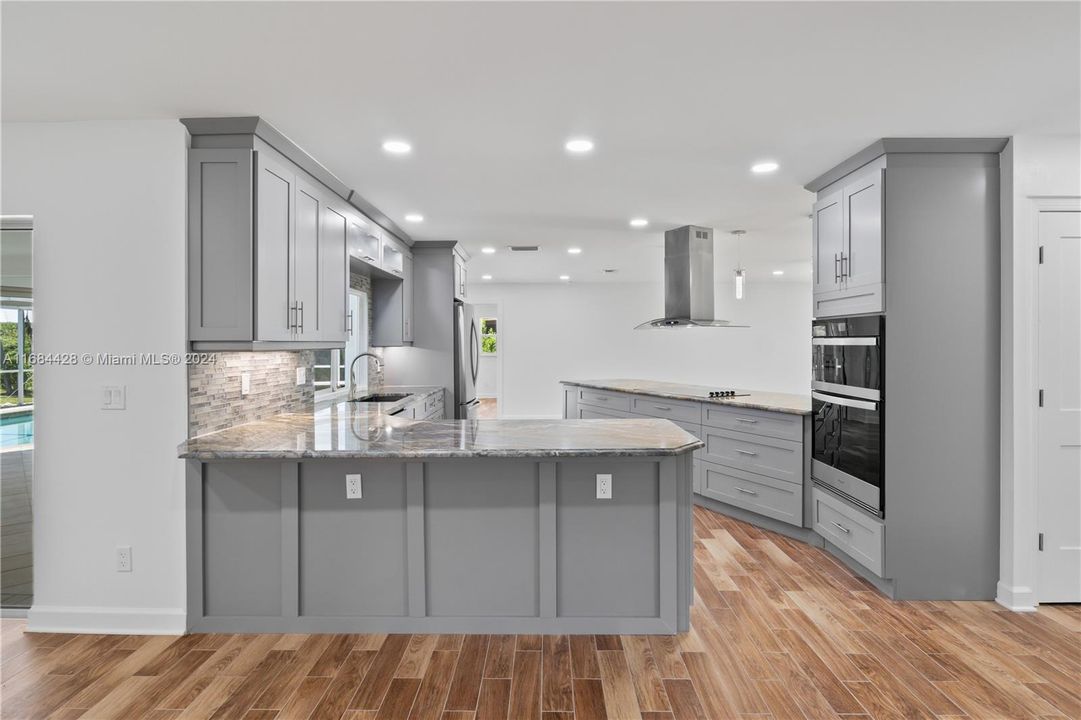 This kitchen is a DREAM!!!!!!! Calling all gourmet chefs - state of the art appliances, tons of cabinetry and counter space - opens to the living areas for that great room feel!