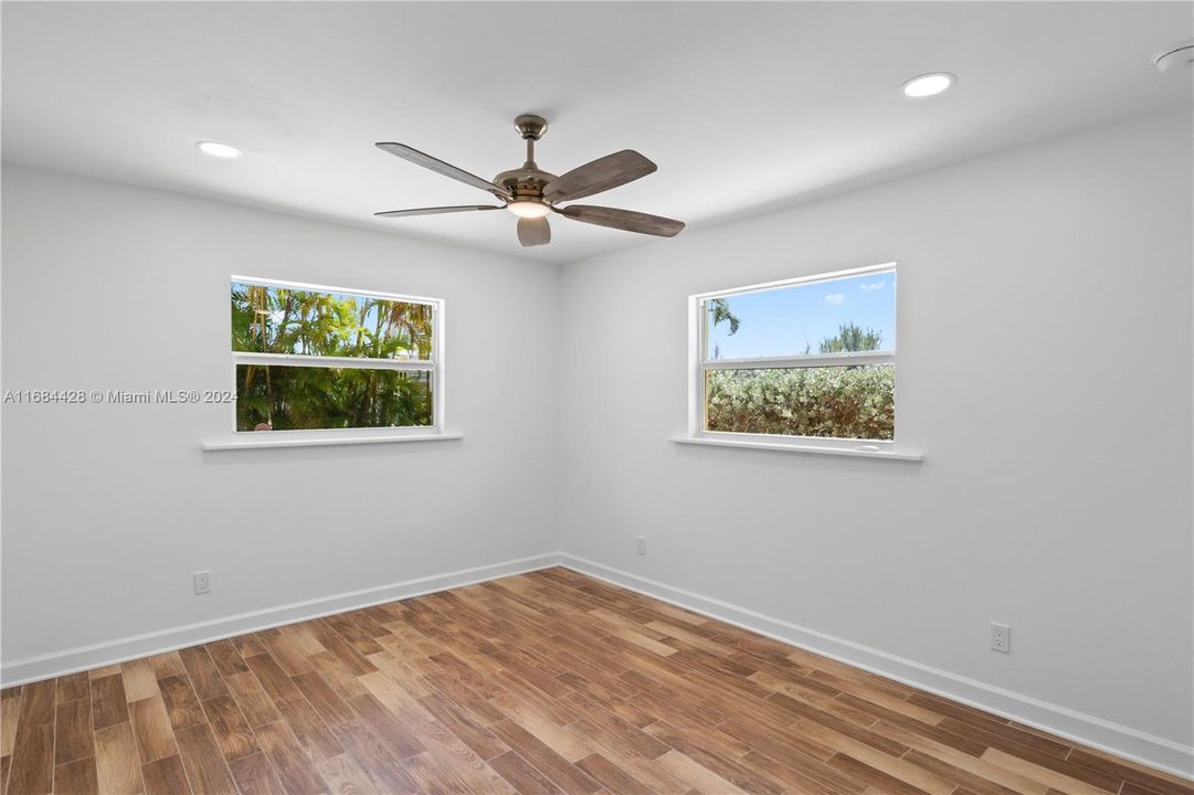 Rear guest bedroom with beautiful backyard views! All hurricane impact windows!