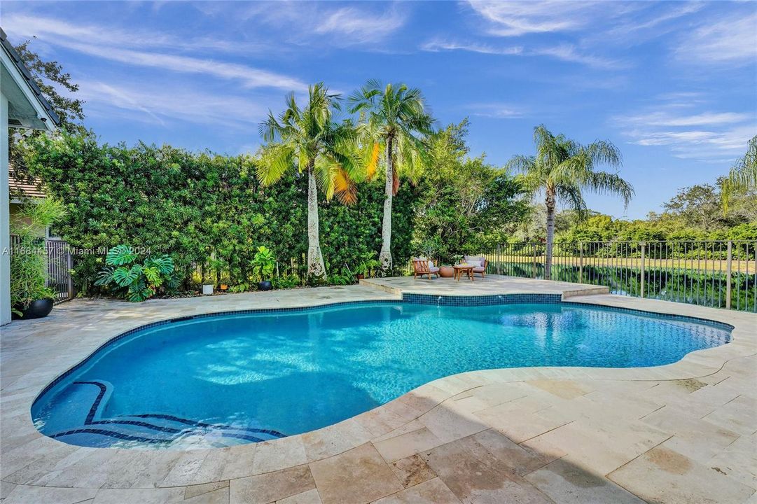 Salt water pool.  Spacious patio with lots of room for entertaining overlooking the lake.