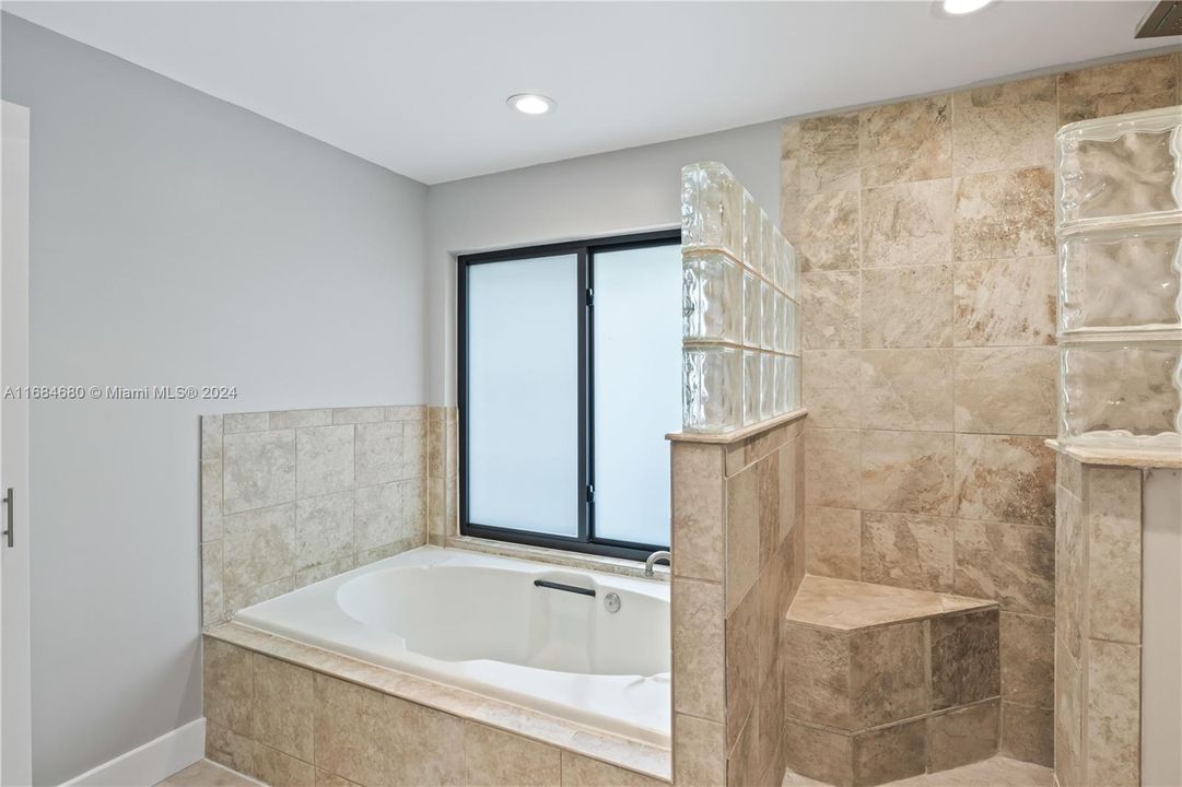 Master bath with jacuzzi tub, large walk in shower.