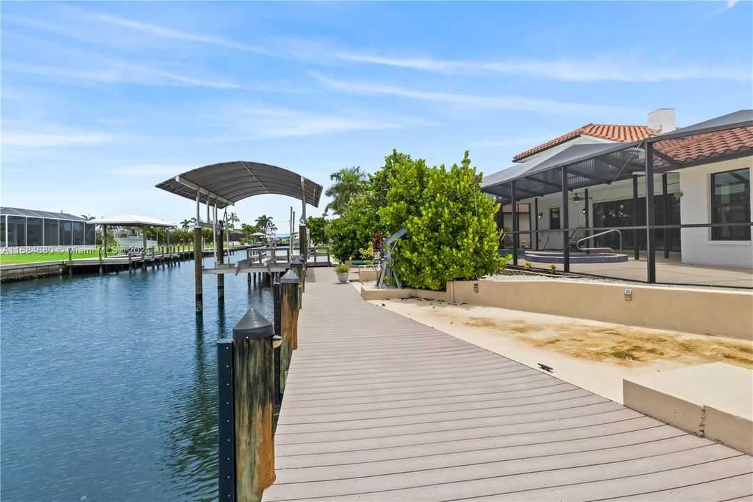 Ten thousand pound boat lift with canopy cover and trex deck. Nice seating area out on the dock with plenty of room to add a tiki bar or additional outdoor living space.