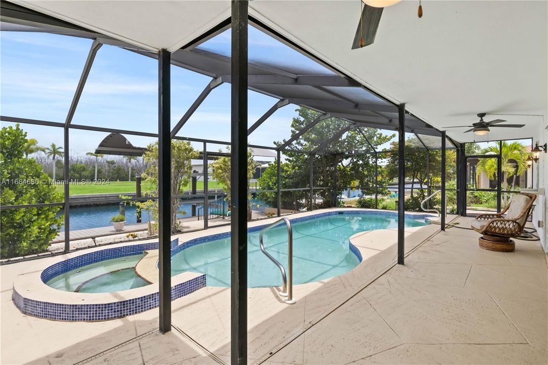 HUGE expansive under shade patio with sparkling pool and spa - a beautiful back yard retreat to enjoy the weather year round!