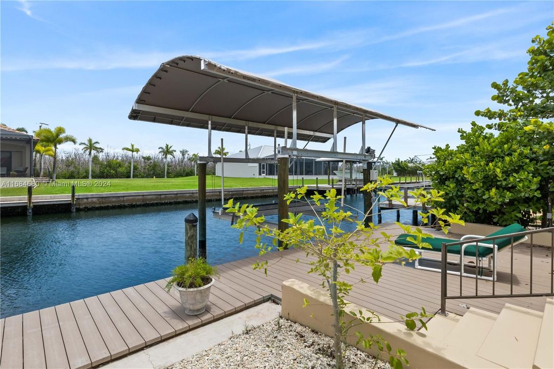 Ten thousand pound boat lift with canopy cover and trex deck. Nice seating area out on the dock with plenty of room to add a tiki bar or additional outdoor living space.