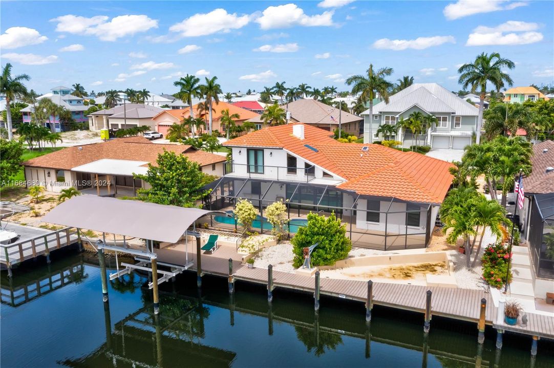 Ten thousand pound boat lift that is canoped and still has plenty of room to add a second dock if wanted. Easy access to the water and a sparkling pool and spa to relax and enjoy in!