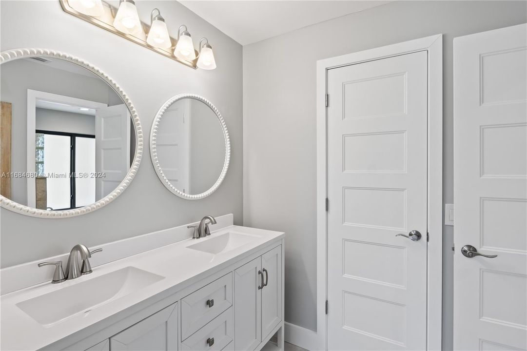 Double vanities, walk in closet and check out those beautiful doors - devil is in the details!