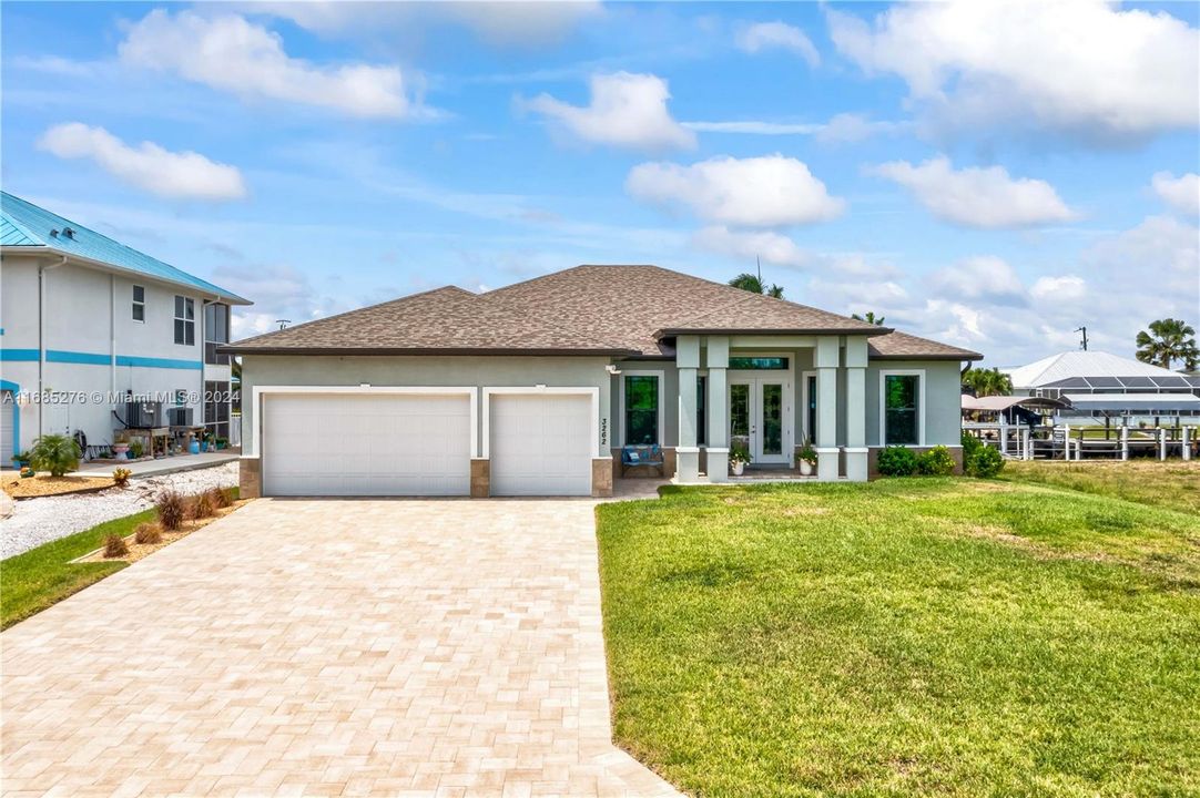 Welcome home! PARADISE!!! Right here at your fingertips! Custom three bedroom and den home with three bathrooms -STUNNING location just 3 lots down from open waters!