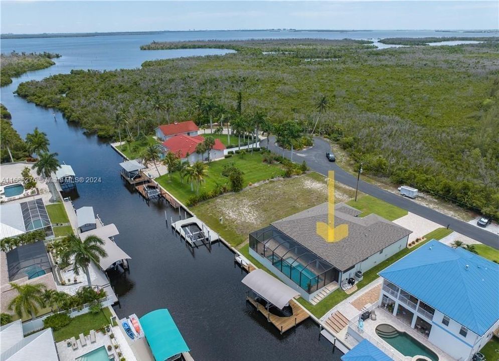 LOCATION LOCATION LOCATION! What an incredible opportunity to live on such a wide canal aptly named Manatee Canal, with DIRECT ACCESS out to the water! A custom home on a quiet culdesac with an additional parking area across the road! A wonderful opportunity to join the vibrant Island life and live your best life!