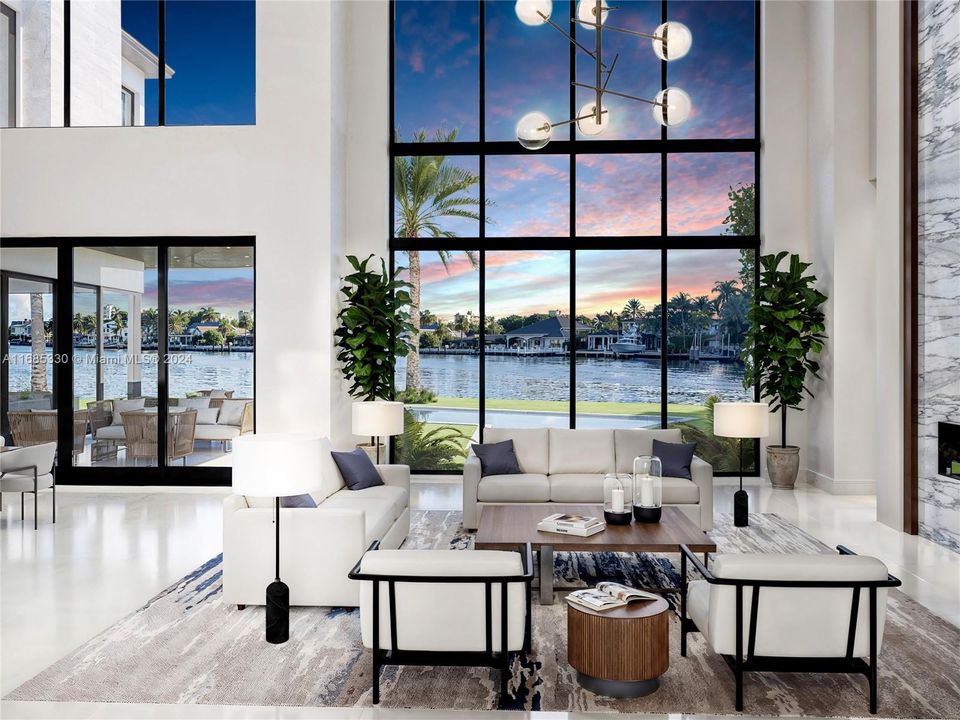 Elegant living room with expansive windows, capturing serene east-facing water views