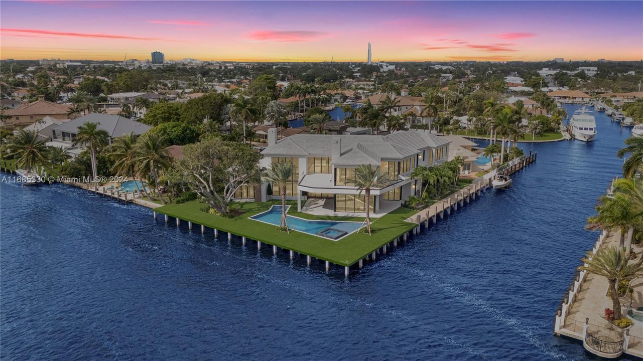 breathtaking aerial view showcasing the home’s expansive waterfront position and prime dock space