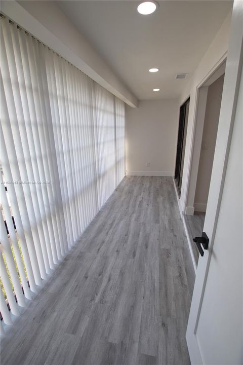 View of enclosed balcony from utility/laundry room