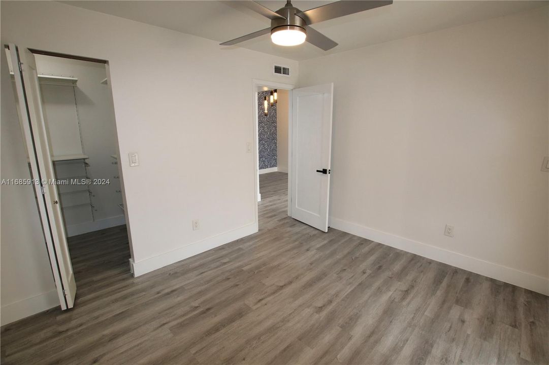 Bedroom with walk in closet on left