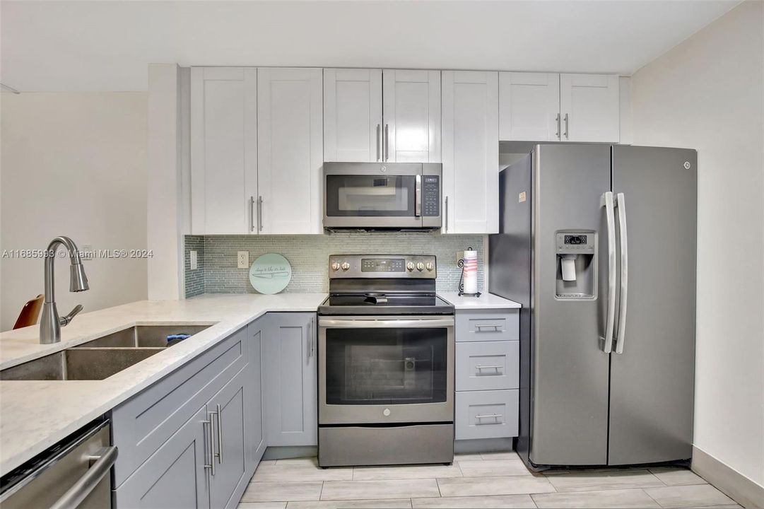 Upgraded cabinets, quartz counters, stainless appliances.