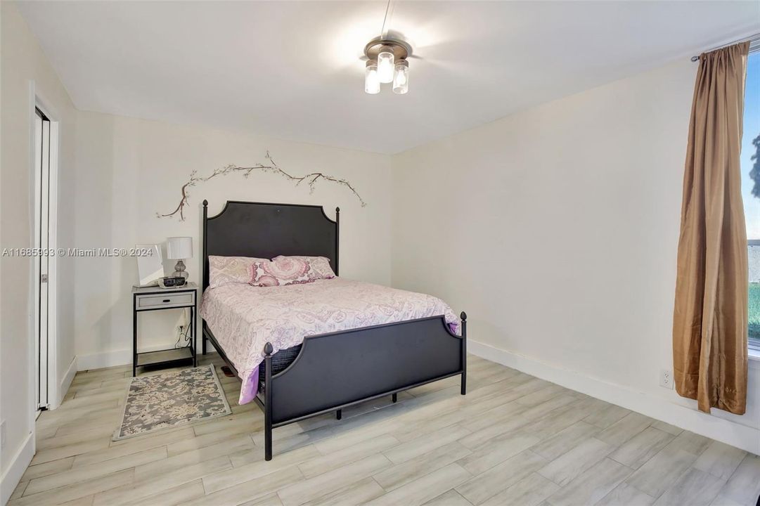 Primary bedroom with plenty of room for more furnishings.