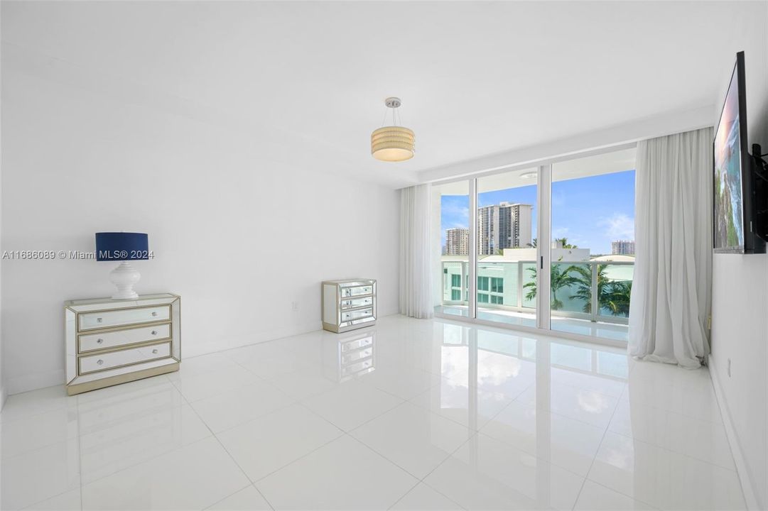 Main Bedroom with motorized blinds and spacious balcony