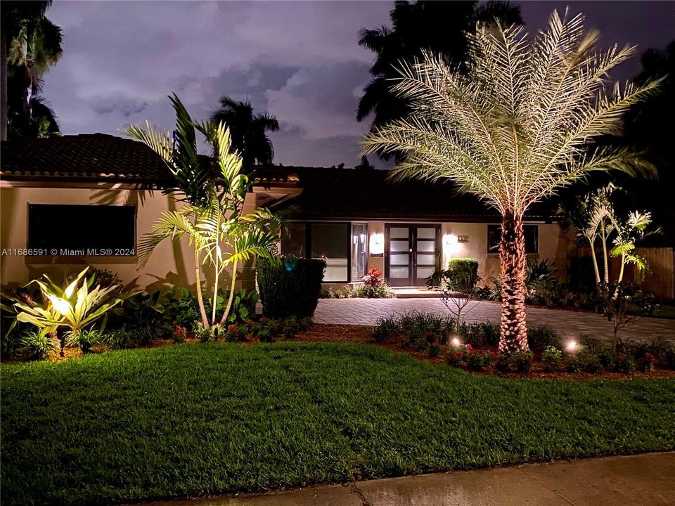 Gorgeous landscaping enhanced by accent lighting