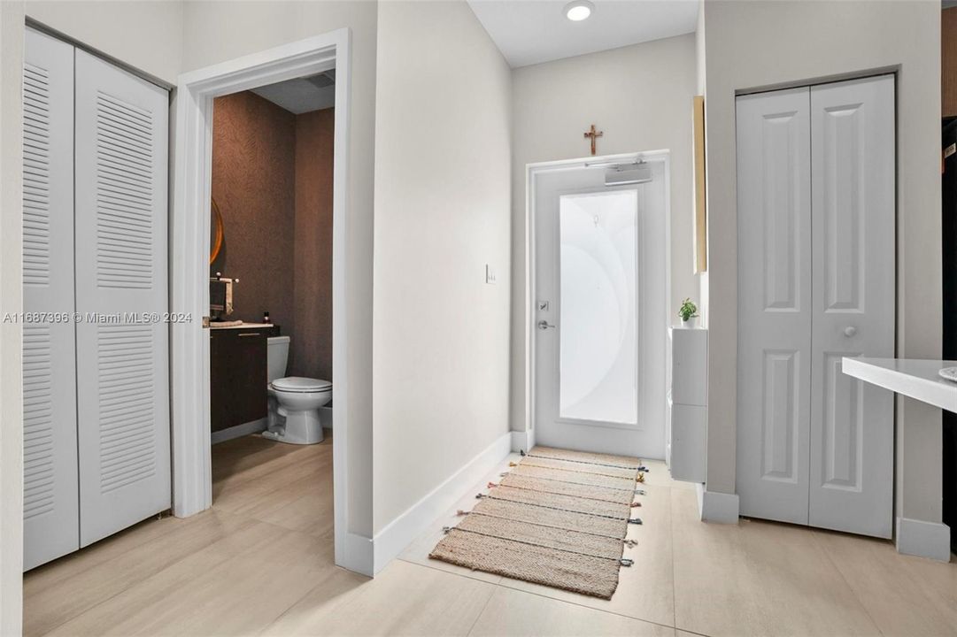 Foyer and entrance to luxurious guest bathroom