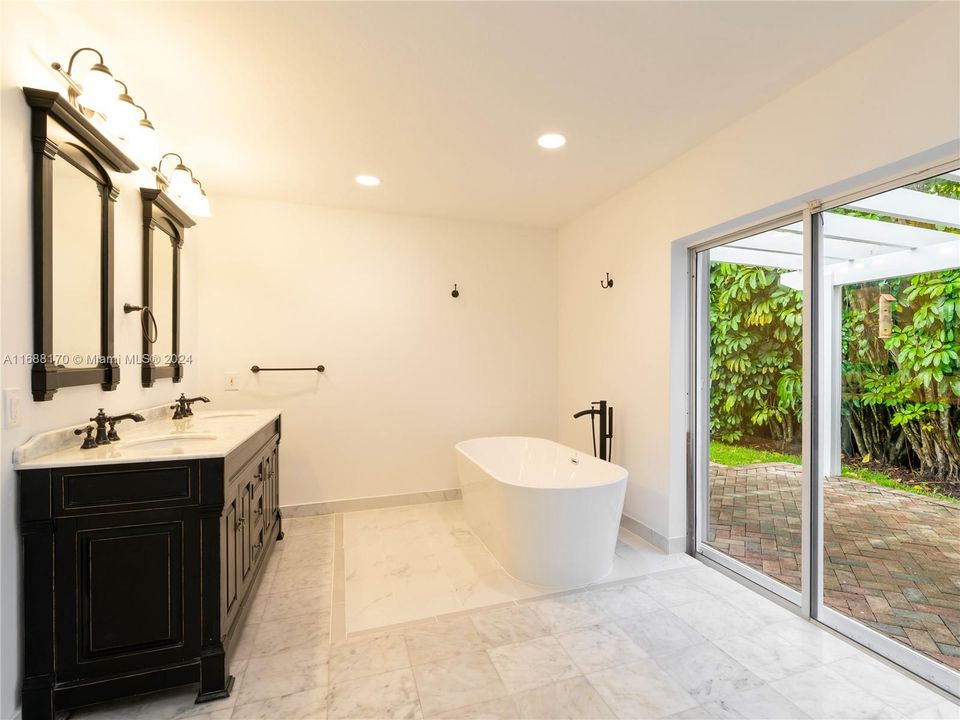 Primary Bathroom with Soaking Tub and Private Patio