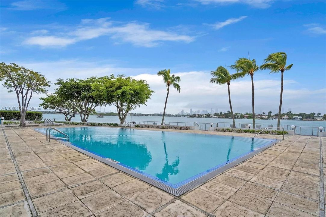 Pool deck w gorgeous skyline and sunset views