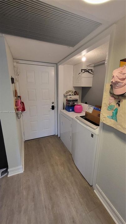 Main entry door/hallway with laundry