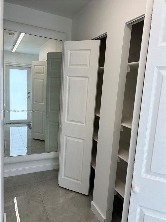 hallway with closets