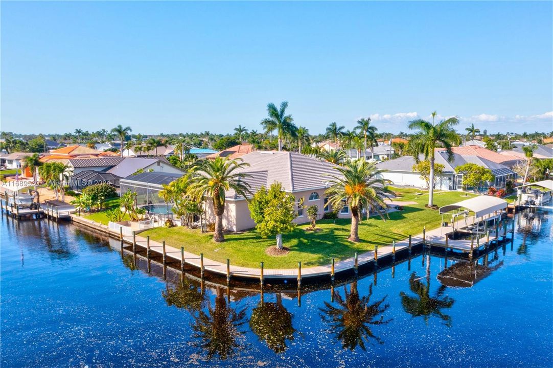 180 degree view of the extensive Captain's walk, canopied boatlift and beautiful home and gardens!