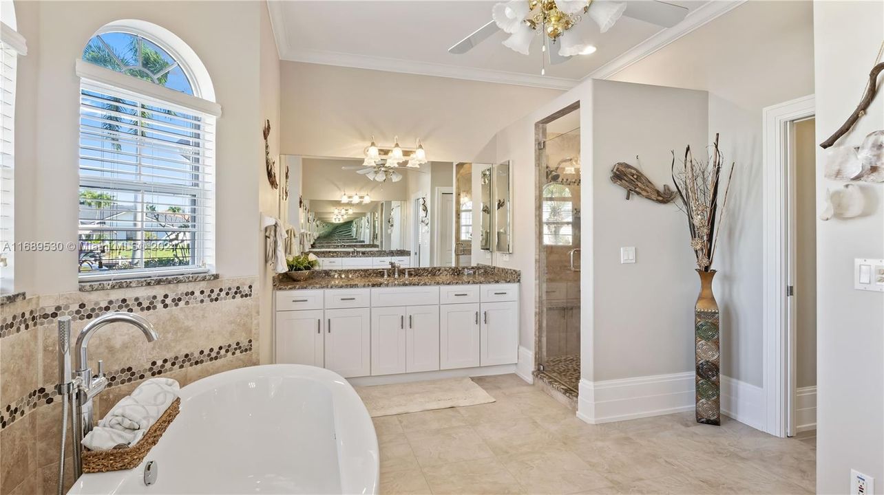 Large walk in closet, private toilet closet, beautiful designer tile and accents and granite countertops - this is a luxurious but comfortable master bathroom with large walk in closets and an oversized and private master suite!