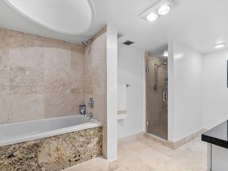 Primary Bathroom with Tub and Walk in Shower