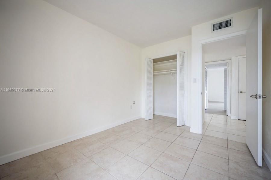 This is the NW Bedroom, the second bedroom with tile floors and a nice closet.