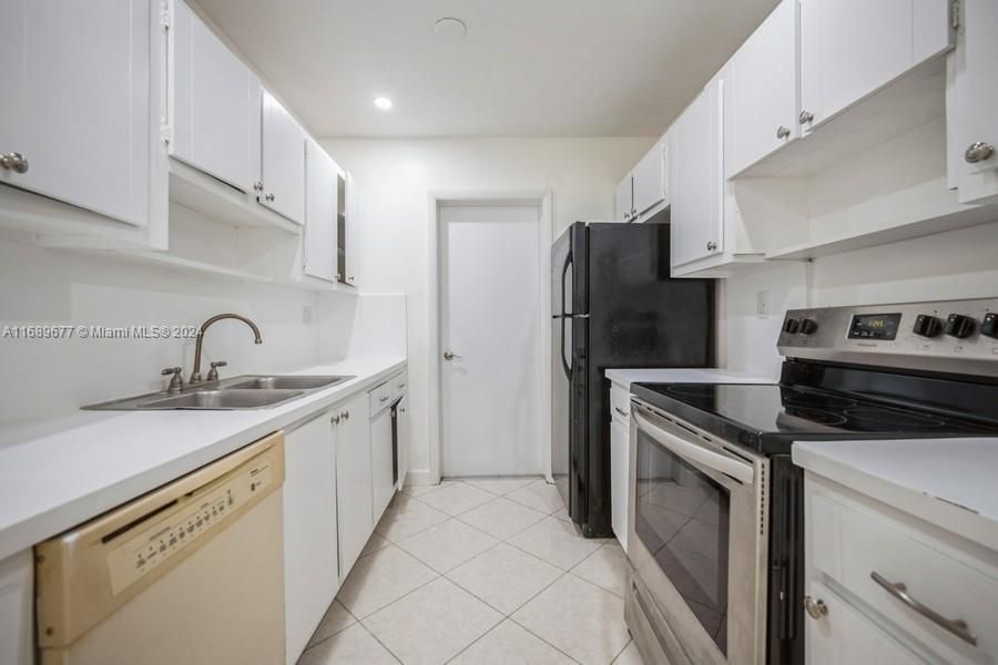 Here is the same picture but looking beyond the kitchen to the 1C-garagegarage door.