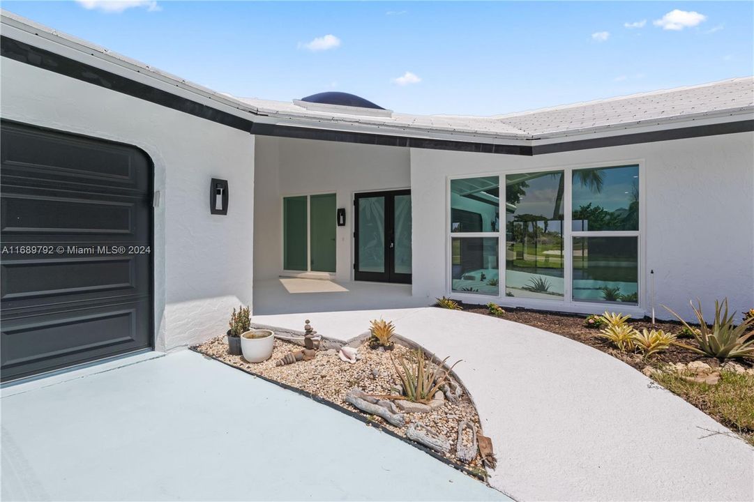 Welcome home to a wonderful large front patio with plenty of room for seating!