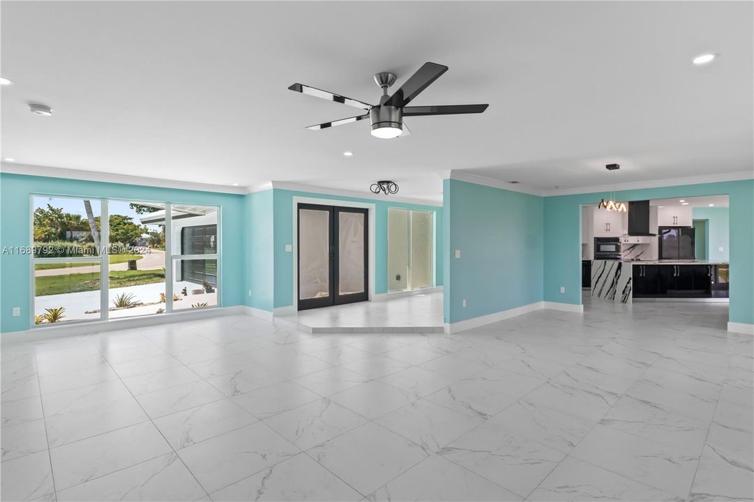 Entry into the front living area with a view of the SPECTACULAR kitchen! Coastal and Contemporary!